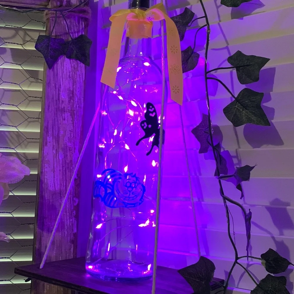 Iridescent Cheshire Cat wine bottle lantern